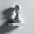 3D printed wall shelf with a large minimalist chess pawn integrated into a small rectangular ledge.