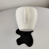 Additional product detail of Floating Coffee Cup Sculpture.