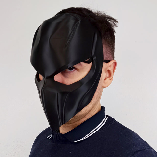 3D printed tactical supervillain mask with angular panels and a full-face armored silhouette.