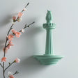 3D printed wall decor inspired by the Statue of Liberty torch.