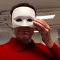 Unfinished 3D printed half-face craft mask with a smooth surface ready for sanding, priming and painting.