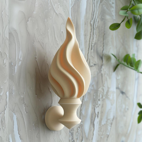 3D printed wall decor shaped like a stylized torch flame.