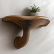 3D printed mushroom wall shelf with a rounded cap, sculpted stem and compact floating ledge.
