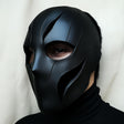 Black 3D printed full-face tactical mask with faceted cyberpunk geometry and ventilation openings.