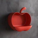 Apple-shaped 3D printed wall shelf with a compact ledge for lightweight decor.