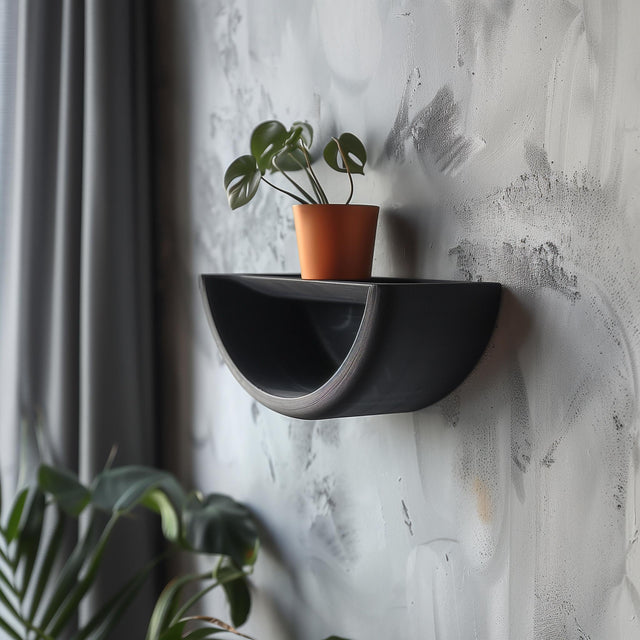 Half-circle 3D printed wall shelf with a curved frame and small plant display.