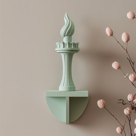 3D printed wall decor shaped like the Statue of Liberty torch.
