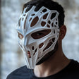 3D printed biomorphic cyberpunk mask with organic skeletal openings and futuristic facial geometry.