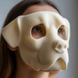 3D printed bulldog-inspired face mask with smooth minimal design, worn by an adult model indoors.