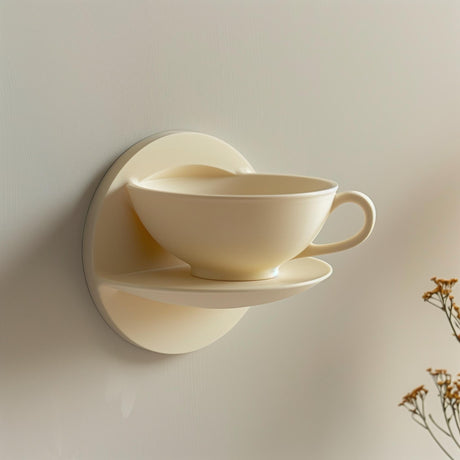 3D printed wall shelf shaped like a teacup and saucer.