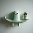 3D Printed Cute Creature Wall Shelf shown in the product image.