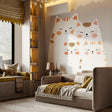 Large wall decal featuring a family of four cute stylized cats in cream and orange tones.