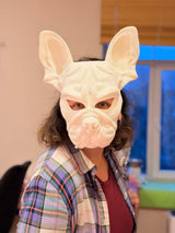 3D printed French bulldog mask with upright ears and geometric dog-face contours.