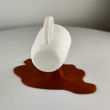 Product detail view of Spilled Espresso Sculpture.
