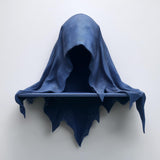3D printed matte PLA wall shelf shaped like a hooded cloaked wraith with a small straight ledge.