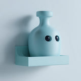 Cute 3D printed matte PLA wall shelf with an integrated kawaii potion bottle character, in soft pastel blue.