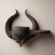 3D printed matte PLA wall shelf with a horned skull-like base.