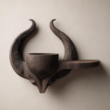 3D printed matte PLA wall shelf with a horned skull-like base.