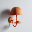 3D printed matte PLA wall-mounted mushroom shaped candle holder with a domed shade and small round platform.