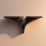 3D printed dark wall shelf with a dramatic broken-rift design in the center.