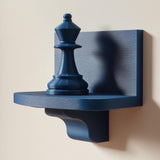 3D printed wall-mounted shelf featuring a chess queen piece standing on a compact floating ledge.