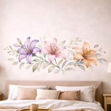 A horizontal watercolor illustration of three lilies in a row on a white background.