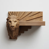 3D printed lion head wall shelf with Art Deco sunburst backplate and stepped geometric floating ledge.