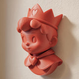 3D printed wall-mounted cute anime prince figure with a crown and heart-shaped cape detail.