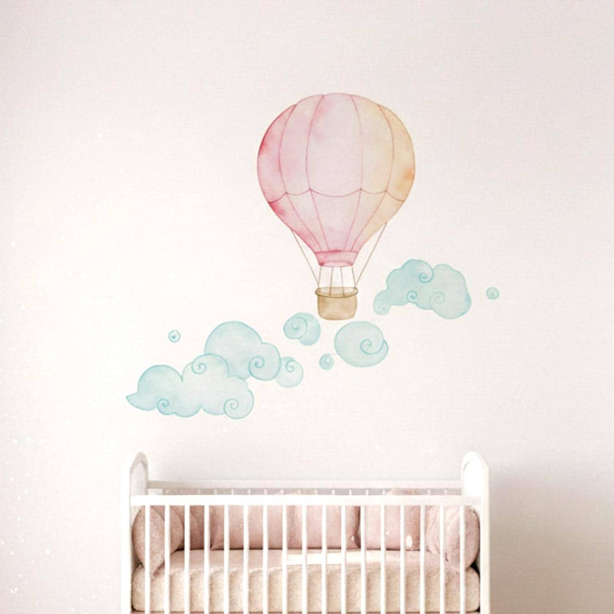 Watercolor wall decal of a pink and pale orange hot air balloon with whimsical nursery details.