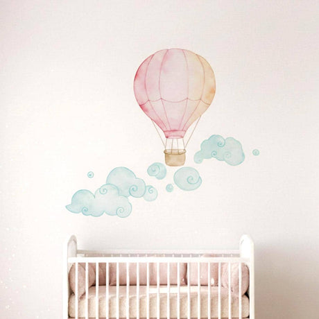 Watercolor wall decal of a pink and pale orange hot air balloon with whimsical nursery details.