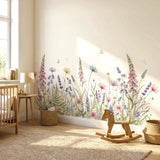 A wide, horizontal watercolor illustration of a wildflower meadow against a white background.