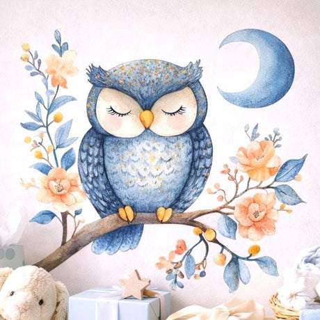 A watercolor illustration of a round blue owl with closed eyes perched on a brown branch.