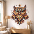 A symmetrical, highly detailed illustration of an owl on a black background.