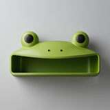 3D printed frog character wall shelf with round eyes and open storage cubby