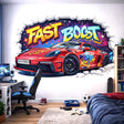 Red race car graffiti wall decal bursting through a white brick wall