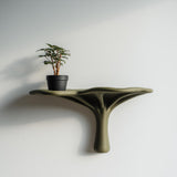 3D printed nature-inspired wall shelf with tree-like flowing support and wide ledge