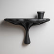 3D printed organic wall shelf with flowing sculptural support and horizontal display ledge