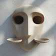 3D printed abstract face wall shelf with two removable cup-shaped display platforms