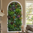 Vertical arched wall decal featuring a dense arrangement of realistic succulents and ferns.