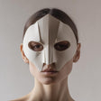 3D printed geometric half face mask with sharp faceted planes and almond eye openings