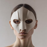 3D printed geometric half face mask with sharp faceted planes and almond eye openings
