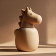 3D printed horse-shaped pet ashes urn in warm neutral beige with visible print texture.