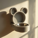 3D printed bear-shaped wall mounted pet bowl holder with round ears and a circular bowl opening.