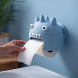 3D printed spiky kawaii monster wall mounted toilet paper holder with round eyes and teeth.