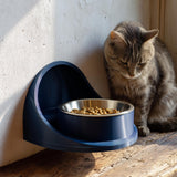 3D printed minimal wall pet bowl holder with curved bracket and circular opening