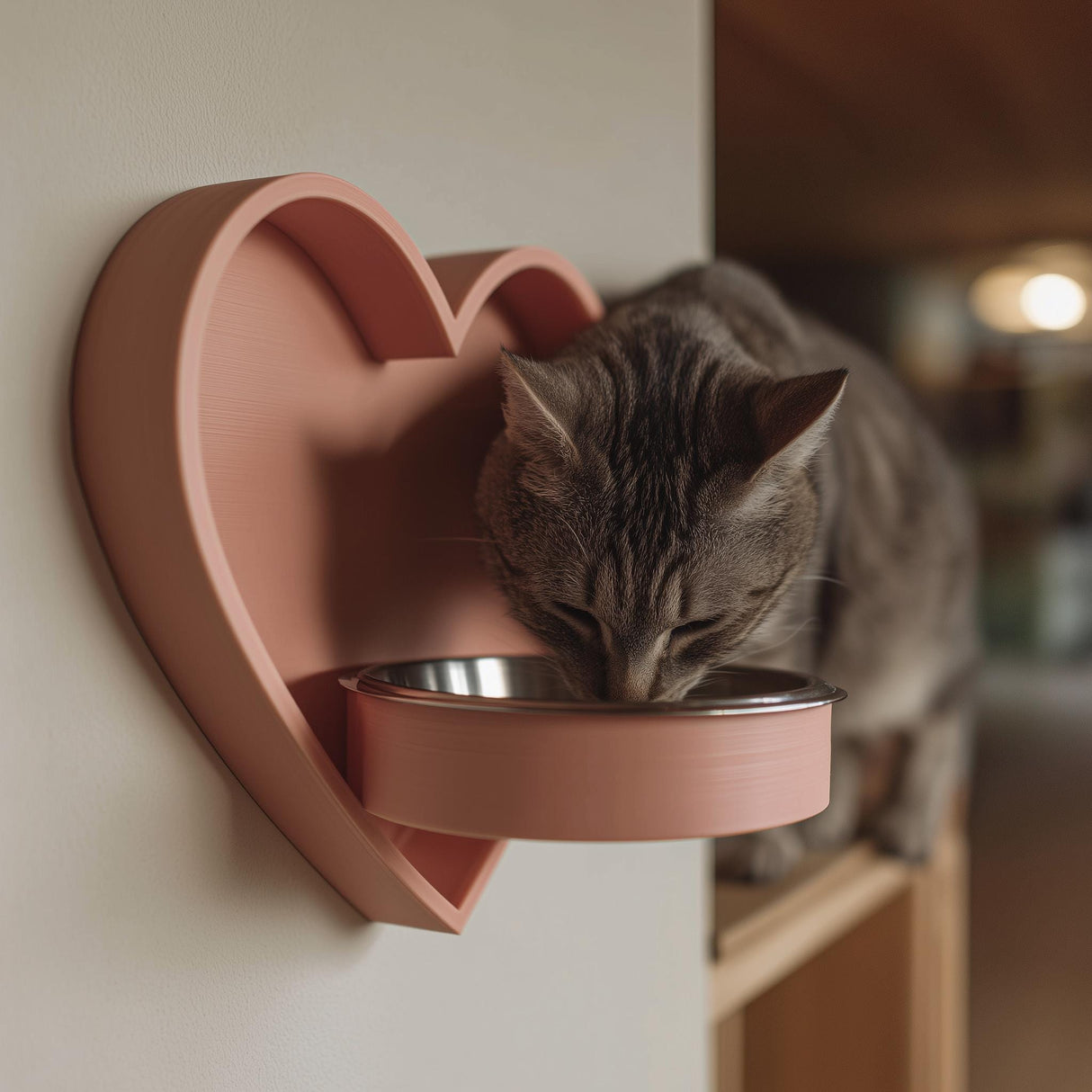 3D printed heart-shaped wall mounted pet bowl holder with a round bowl opening.