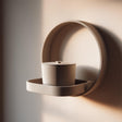 3D printed circular memorial wall shelf with matching cylindrical urn