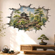 3D broken wall vinyl decal showing a watercolor Japanese garden with a pagoda, arched bridge and trees.