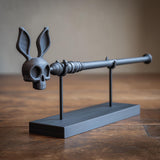 3D printed rabbit skull magic wand with textured shaft and matching display stand