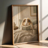 Product presentation view of Sheltie Guinea Pig Reading in Bed Poster.